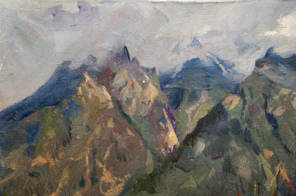 Mountain peaks surrounded by clouds were captured in an oil painting by an unknown artist