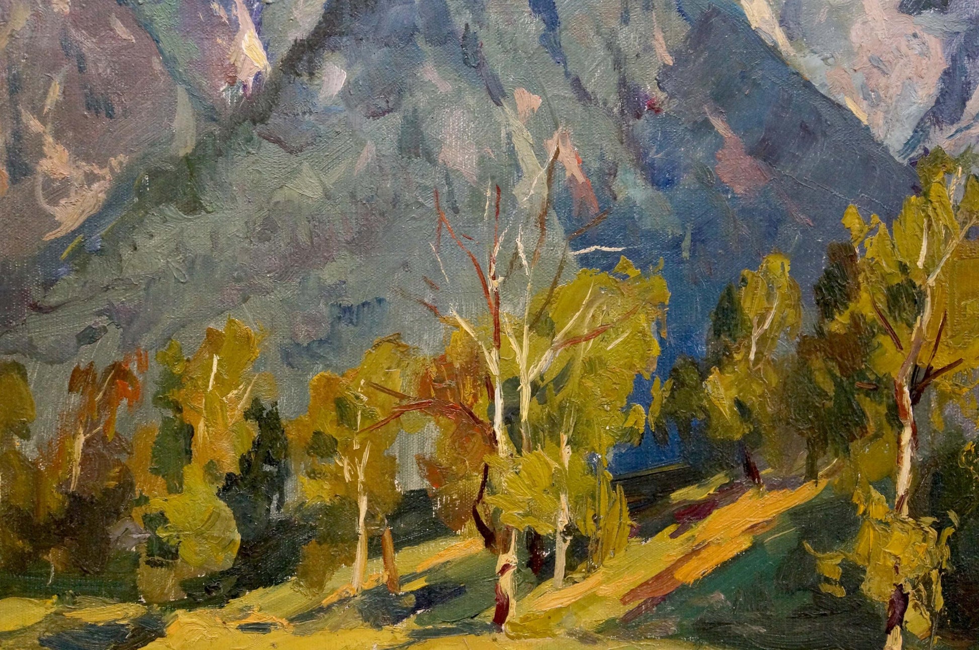 The artist's identity for the oil painting featuring mountain peaks and clouds is a mystery