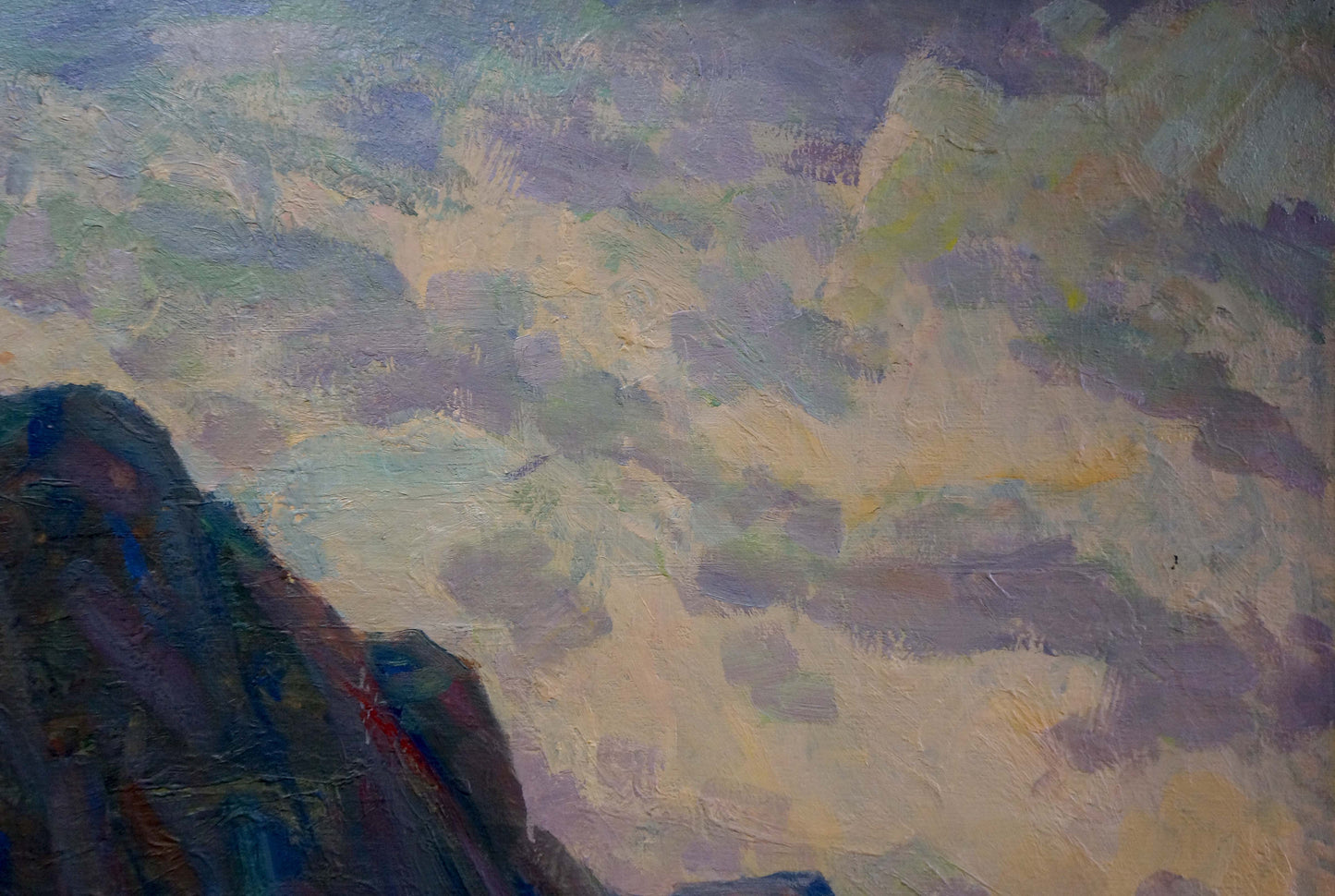Mountains adjacent to the sea were captured in an oil painting by an unknown artist