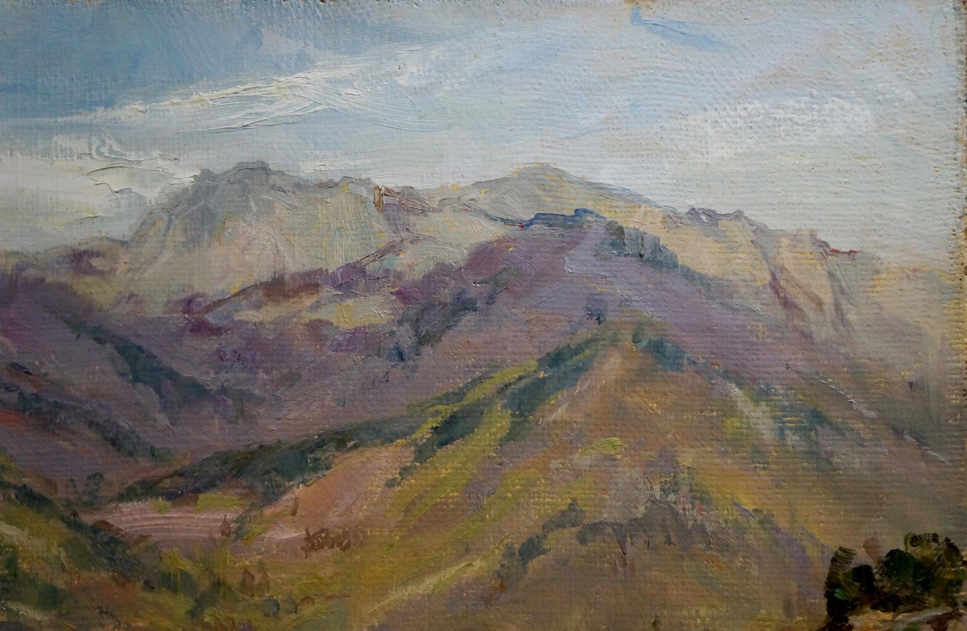 City among mountains portrayed in an oil painting by an unknown artist